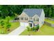 Aerial view of a beautiful home with well-manicured lawn and fenced backyard at 735 Sweethaven Ln, Loganville, GA 30052