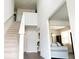 Bright foyer featuring high ceilings, staircase, and open view into living room at 735 Sweethaven Ln, Loganville, GA 30052