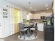 Eat-in kitchen featuring white cabinets, stainless appliances, granite countertops, and a center island at 735 Sweethaven Ln, Loganville, GA 30052