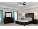 Main bedroom features a king bed, large dresser, and a neutral color scheme at 735 Sweethaven Ln, Loganville, GA 30052