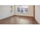Bedroom with two windows bringing in natural light and wood-look flooring at 1250 Oxley Nw Ln, Atlanta, GA 30307
