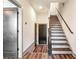 Bright foyer with hardwood floors, staircase and entry to other rooms at 1250 Oxley Nw Ln, Atlanta, GA 30307
