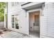 Inviting front entrance of a charming home with a white exterior and classic architectural details at 1250 Oxley Nw Ln, Atlanta, GA 30307