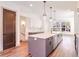 Open kitchen showcasing an island with bar seating, modern appliances, and hardwood floors at 1250 Oxley Nw Ln, Atlanta, GA 30307