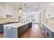 Modern kitchen with a large center island, pendant lights, stainless steel appliances, and white cabinets at 1250 Oxley Nw Ln, Atlanta, GA 30307