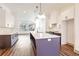 Bright kitchen featuring a large center island, pendant lighting, and modern finishes at 1250 Oxley Nw Ln, Atlanta, GA 30307