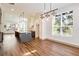 Bright, open-concept kitchen with a large island, stylish pendant lights, and hardwood floors at 1250 Oxley Nw Ln, Atlanta, GA 30307