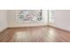 Bright living space with large windows offering natural light and hardwood flooring at 1250 Oxley Nw Ln, Atlanta, GA 30307
