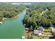 Picturesque aerial shot of a waterfront property with a private dock and lake access at 3441 Shoreland Dr, Buford, GA 30518