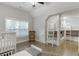 Bright bedroom with built-in bunk beds, hardwood floors, and a large window for natural light at 3441 Shoreland Dr, Buford, GA 30518