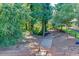 Wooden steps leading to the private dock and lake access with lush trees around at 3441 Shoreland Dr, Buford, GA 30518
