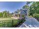 This is a two-story home with a brick facade, a manicured lawn, and a driveway at 3441 Shoreland Dr, Buford, GA 30518
