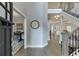 Inviting foyer with hardwood floors, staircase and decorative wall art at 3441 Shoreland Dr, Buford, GA 30518