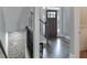 Elegant foyer with dark wood floors and a staircase with dark iron railings at 3441 Shoreland Dr, Buford, GA 30518