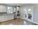 Bright kitchen with stainless steel appliances and white cabinets featuring a view of the deck at 3441 Shoreland Dr, Buford, GA 30518