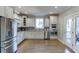 Spacious kitchen equipped with stainless steel appliances, light gray cabinets and hardwood floors at 3441 Shoreland Dr, Buford, GA 30518