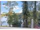 Picturesque lake view surrounded by lush greenery creating a serene and tranquil environment at 3441 Shoreland Dr, Buford, GA 30518