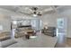 Open-concept living room featuring a coffered ceiling, large windows and access to kitchen and dining area at 3441 Shoreland Dr, Buford, GA 30518