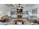 Spacious living room featuring a stone fireplace, floating shelves and a coffered ceiling at 3441 Shoreland Dr, Buford, GA 30518
