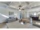 Bright living room featuring a coffered ceiling, large windows and access to kitchen and dining area at 3441 Shoreland Dr, Buford, GA 30518