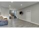 Living room with wood-look floors, shiplap accent wall, brick accent, recessed lighting, and a TV at 3441 Shoreland Dr, Buford, GA 30518
