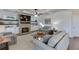 Bright living room featuring a stone fireplace, floating shelves and a coffered ceiling at 3441 Shoreland Dr, Buford, GA 30518