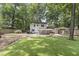 Backyard featuring a pavilion, grassy area, seating area, mature landscaping, and a well-maintained lawn at 3981 Longview Dr, Chamblee, GA 30341