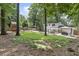 Backyard featuring a pavilion, playset, seating area, firepit, landscaping, and a well-maintained lawn at 3981 Longview Dr, Chamblee, GA 30341