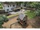 Spacious backyard with mature trees, features a playhouse and a firepit, creating an ideal outdoor space at 3981 Longview Dr, Chamblee, GA 30341