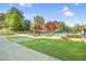 Community pool area featuring lush green spaces, walking paths, and a relaxing atmosphere at 3981 Longview Dr, Chamblee, GA 30341