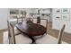Dining room showcasing a dark wood table, comfortable seating, and modern design at 3981 Longview Dr, Chamblee, GA 30341