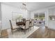 Open dining room with access to outdoor patio, modern lighting, and comfortable seating at 3981 Longview Dr, Chamblee, GA 30341