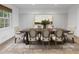 Elegant dining room with a large wooden table, comfortable upholstered chairs, and stylish decor, perfect for Gathering meals at 3981 Longview Dr, Chamblee, GA 30341