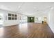Bright event space with hardwood floors, string lights, and multiple doors leading to outdoor areas, perfect for gatherings at 3981 Longview Dr, Chamblee, GA 30341