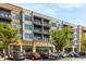 Modern multi-story building with balconies and street-level retail, offering a vibrant urban living experience at 3981 Longview Dr, Chamblee, GA 30341
