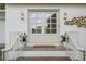 Charming front entrance with double doors, decorative lighting and lovely brick walkway, creating an inviting welcome at 3981 Longview Dr, Chamblee, GA 30341