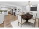 Modern kitchen with white cabinets, stainless steel appliances, a cozy breakfast nook, and hardwood floors throughout at 3981 Longview Dr, Chamblee, GA 30341