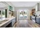 Modern kitchen featuring stainless steel appliances, stylish cabinets, and an open layout with access to the backyard at 3981 Longview Dr, Chamblee, GA 30341