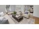 Comfortable living room with hardwood floors, stylish furniture, and a seamless transition to the adjacent dining area at 3981 Longview Dr, Chamblee, GA 30341