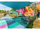 A vibrant outdoor seating area with colorful art mural and contemporary furnishings under a shade canopy at 3981 Longview Dr, Chamblee, GA 30341