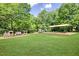 A charming community playground with play train, swings, and playset, surrounded by lush greenery at 3981 Longview Dr, Chamblee, GA 30341
