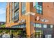 Modern brick building featuring 'Real Tacos' restaurant signage with outdoor seating and decorative plants at 3981 Longview Dr, Chamblee, GA 30341
