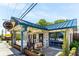Charming brick building with the 'Bluetop' sign, complemented by floral accents and outdoor seating at 3981 Longview Dr, Chamblee, GA 30341