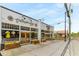 Attractive storefronts with large windows, flower boxes, and inviting wooden doors along a pedestrian-friendly street at 3981 Longview Dr, Chamblee, GA 30341