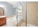 The stunning bathroom is complete with a separate tub and glass door shower at 4503 Kendall Way, Roswell, GA 30075