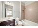 Nicely tiled bathroom with tub, shower, and vanity with sink, fixtures, and lighting at 4503 Kendall Way, Roswell, GA 30075