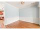 Elegant dining area with hardwood floors, chair rail molding, and soft blue walls at 4503 Kendall Way, Roswell, GA 30075