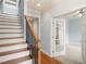 Traditional foyer with wooden stairs, banister and a view of the office space at 4503 Kendall Way, Roswell, GA 30075