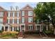 Charming brick townhome with neat landscaping, black shutters, and a welcoming front entrance at 4503 Kendall Way, Roswell, GA 30075