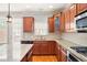 Well-lit kitchen featuring granite countertops, stainless steel appliances and a kitchen island at 4503 Kendall Way, Roswell, GA 30075